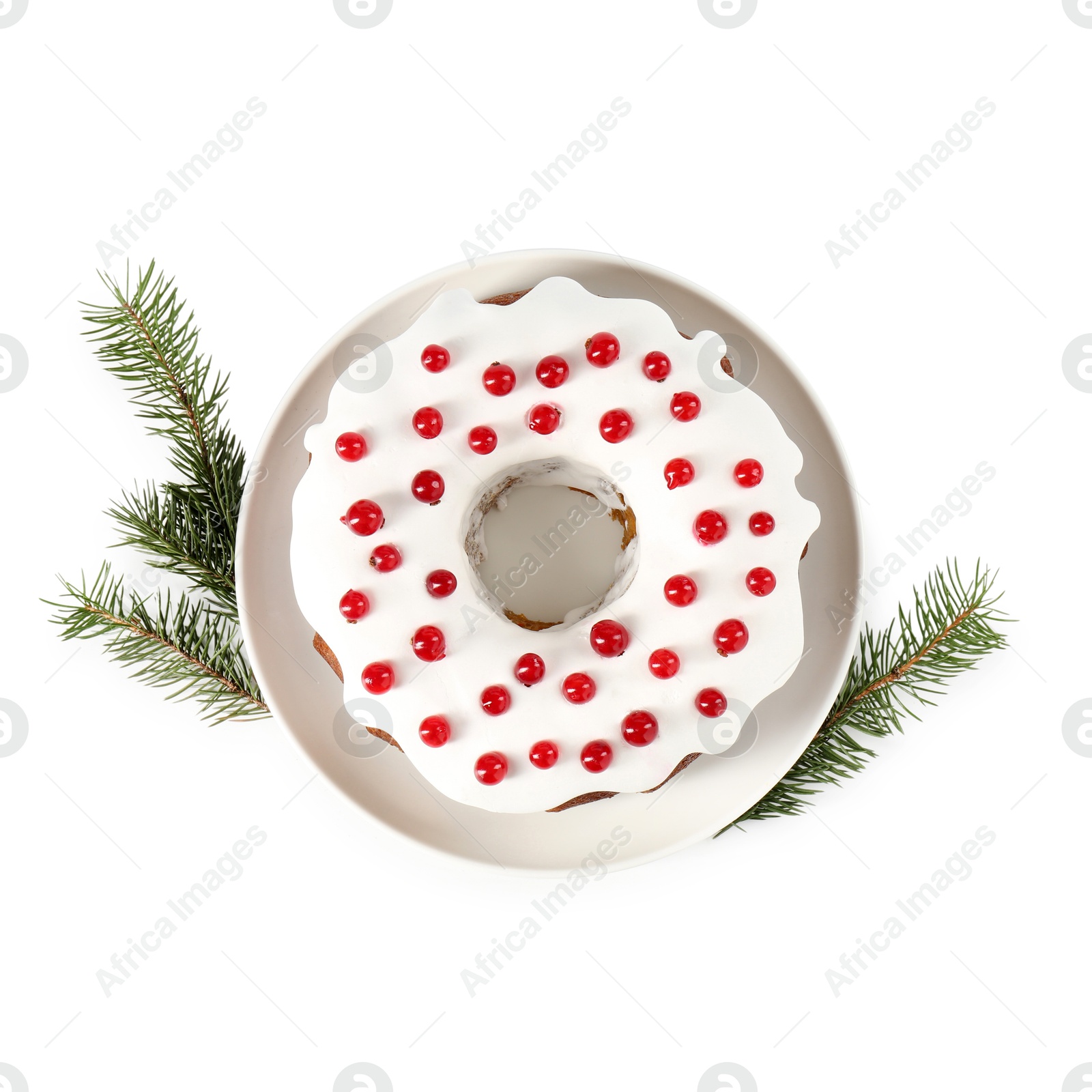 Photo of Tasty Christmas cake with red currants and fir branches isolated on white, top view