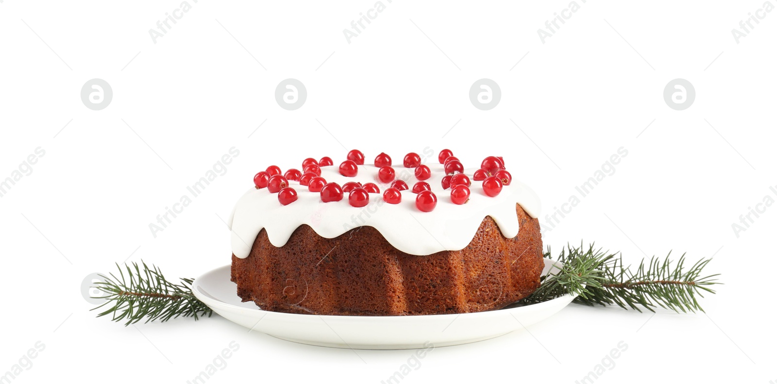 Photo of Tasty Christmas cake with red currants and fir branches isolated on white