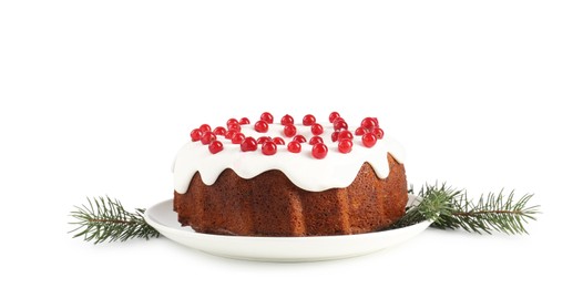 Photo of Tasty Christmas cake with red currants and fir branches isolated on white