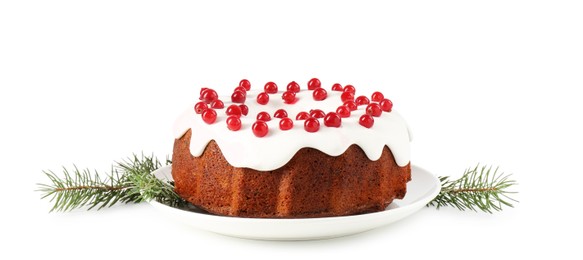 Photo of Tasty Christmas cake with red currants and fir branches isolated on white