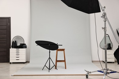 Photo of Professional lighting equipment setup in modern photo studio