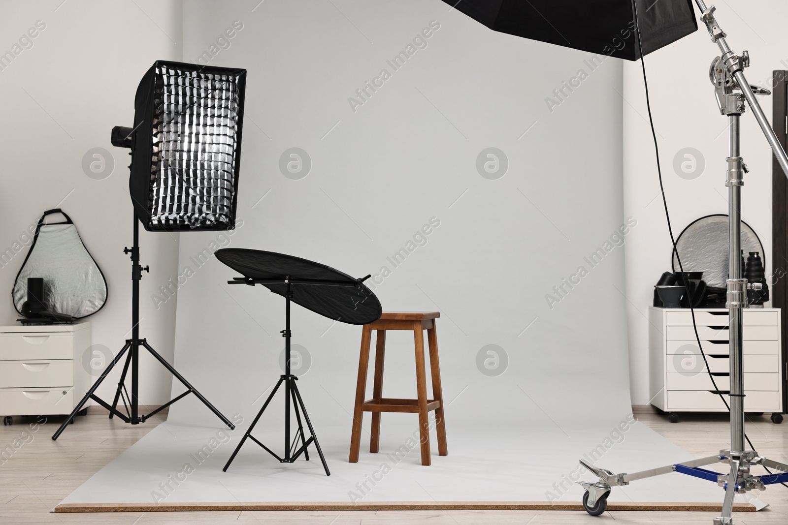 Photo of Professional lighting equipment setup in modern photo studio