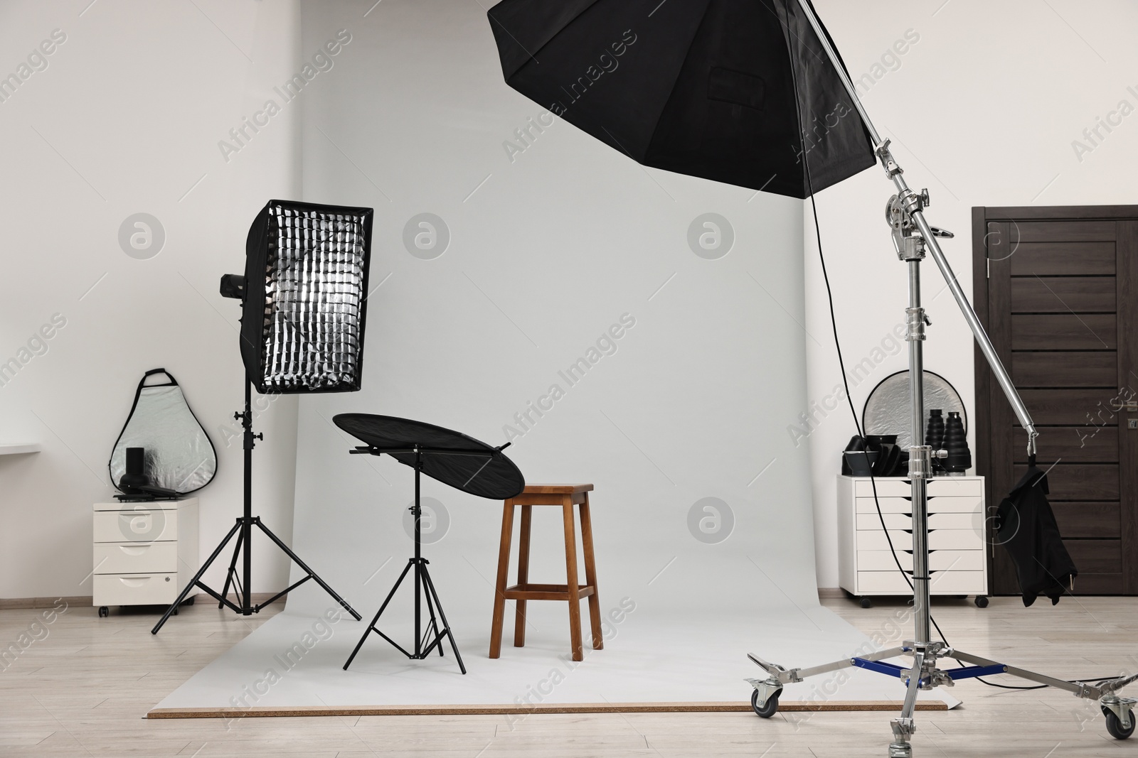 Photo of Professional lighting equipment setup in modern photo studio