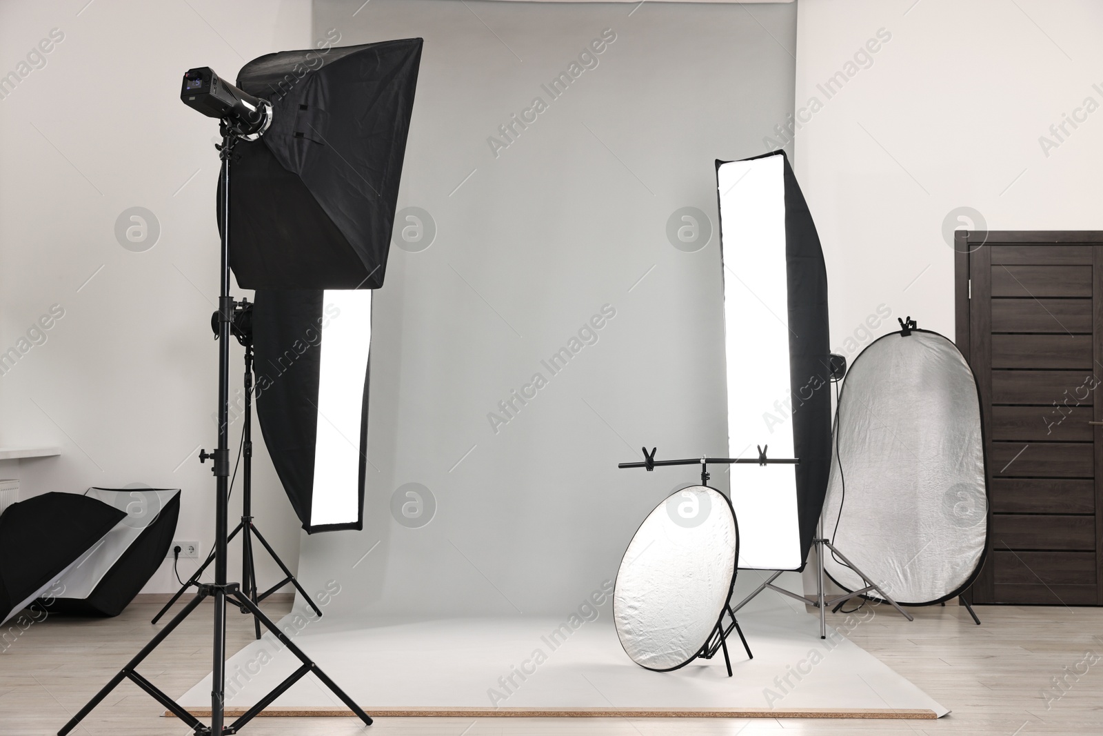 Photo of Professional lighting equipment setup in modern photo studio