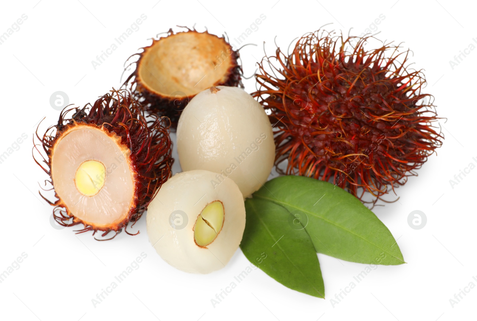 Photo of Delicious ripe rambutans and green leaves isolated on white. Exotic fruit