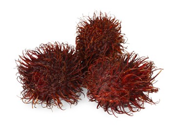 Photo of Delicious ripe rambutans isolated on white. Exotic fruit