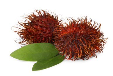 Photo of Delicious ripe rambutans and green leaves isolated on white. Exotic fruit