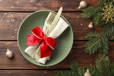 Photo of Christmas setting and festive decor on wooden table, flat lay