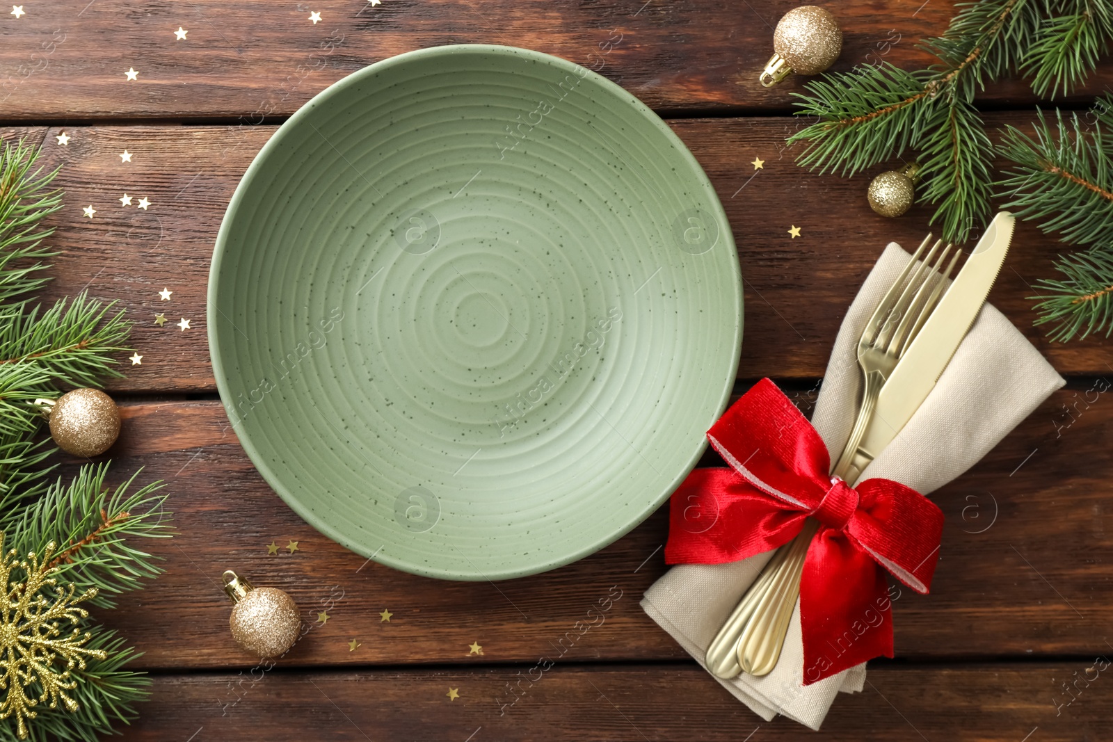 Photo of Christmas setting and festive decor on wooden table, flat lay