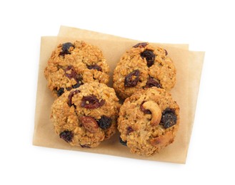 Photo of Delicious oatmeal cookies with dried cranberries and nuts isolated on white, top view