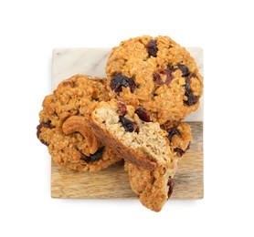 Photo of Delicious oatmeal cookies with dried cranberries and nuts isolated on white, top view