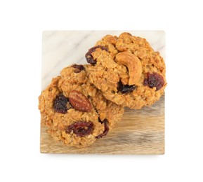 Photo of Delicious oatmeal cookies with dried cranberries and nuts isolated on white, top view