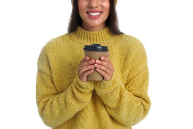 Photo of Happy beautiful woman with paper cup of mulled wine on white background, closeup