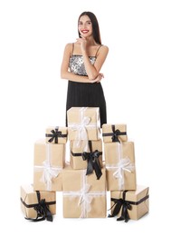 Photo of Woman in party dress with Christmas gifts on white background