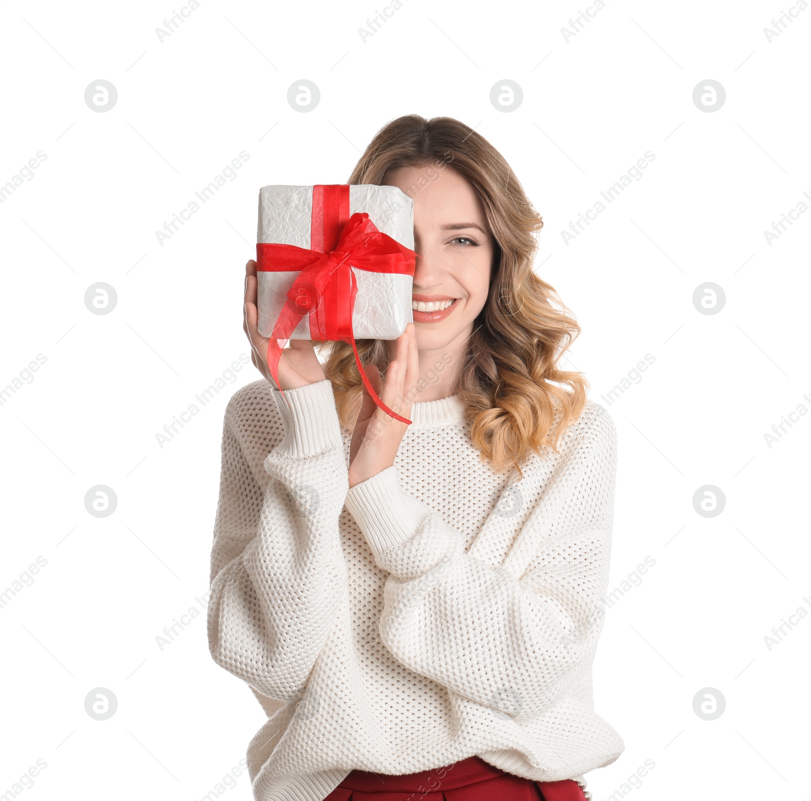 Photo of Beautiful young woman with Christmas present on white background