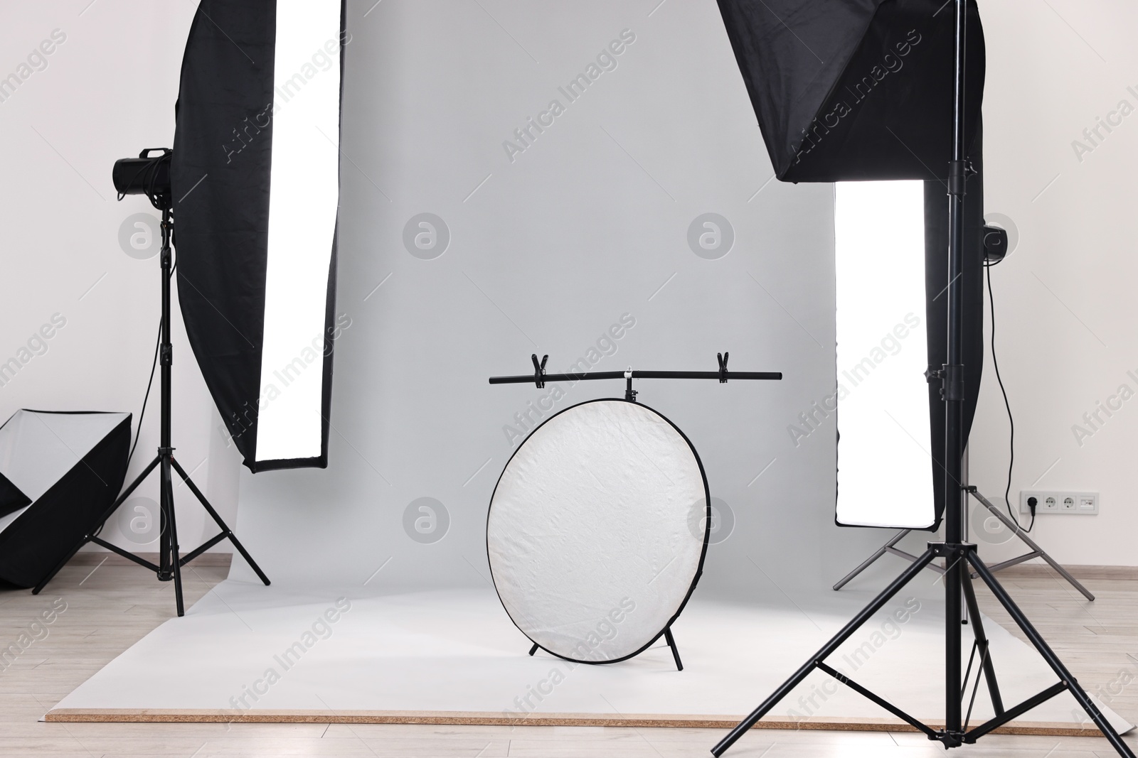 Photo of Professional lighting equipment setup in modern photo studio