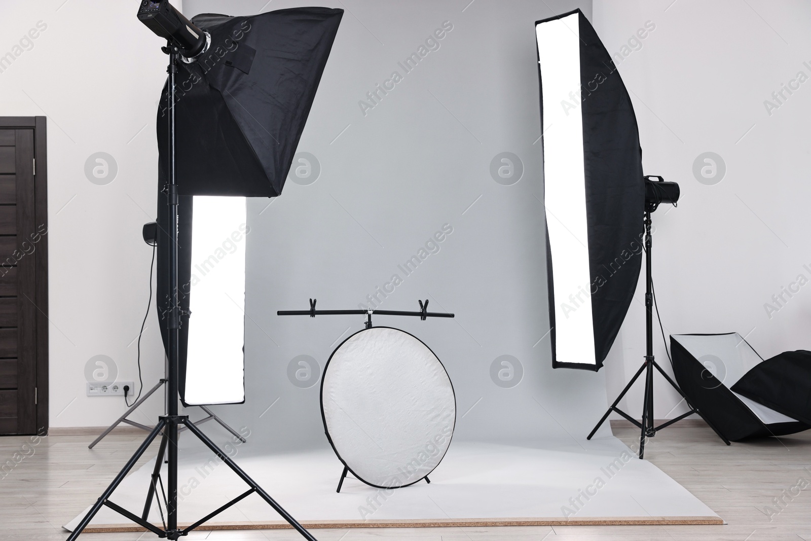 Photo of Professional lighting equipment setup in modern photo studio