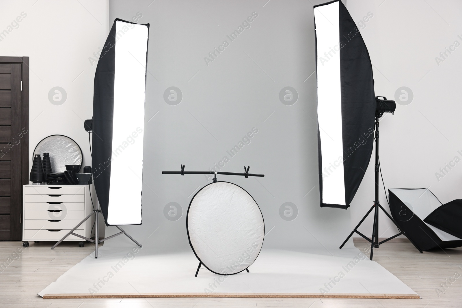 Photo of Professional lighting equipment setup in modern photo studio