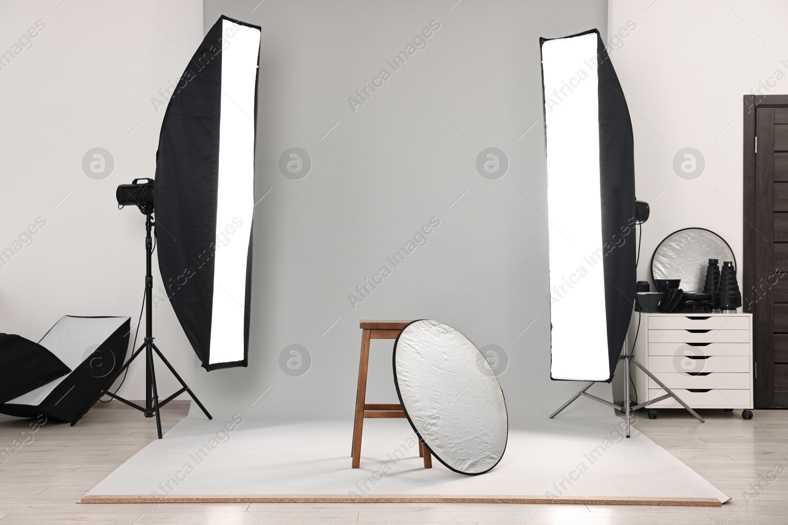 Photo of Professional lighting equipment setup in modern photo studio