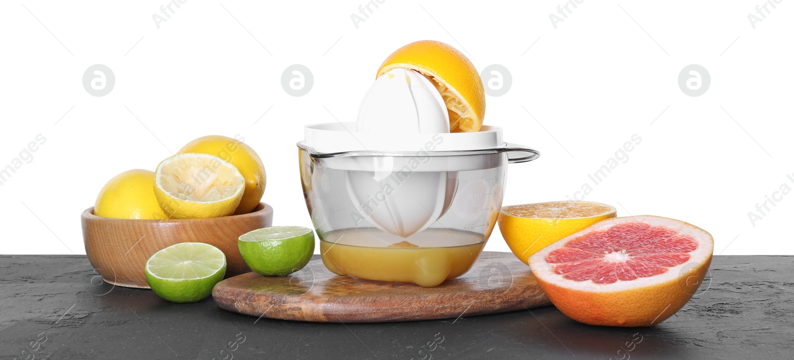 Photo of Plastic juicer and different fresh citrus fruits on black table against white background