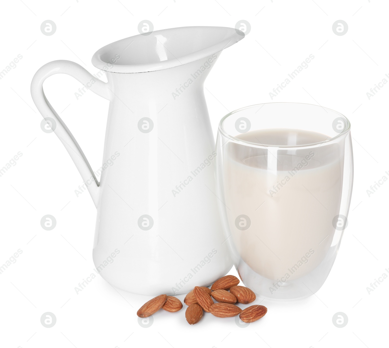 Photo of Glass and jug of almond milk and nuts isolated on white