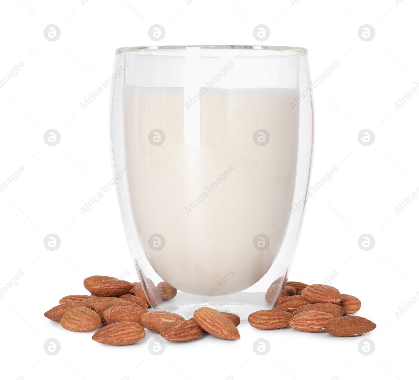 Photo of Glass of almond milk and nuts isolated on white