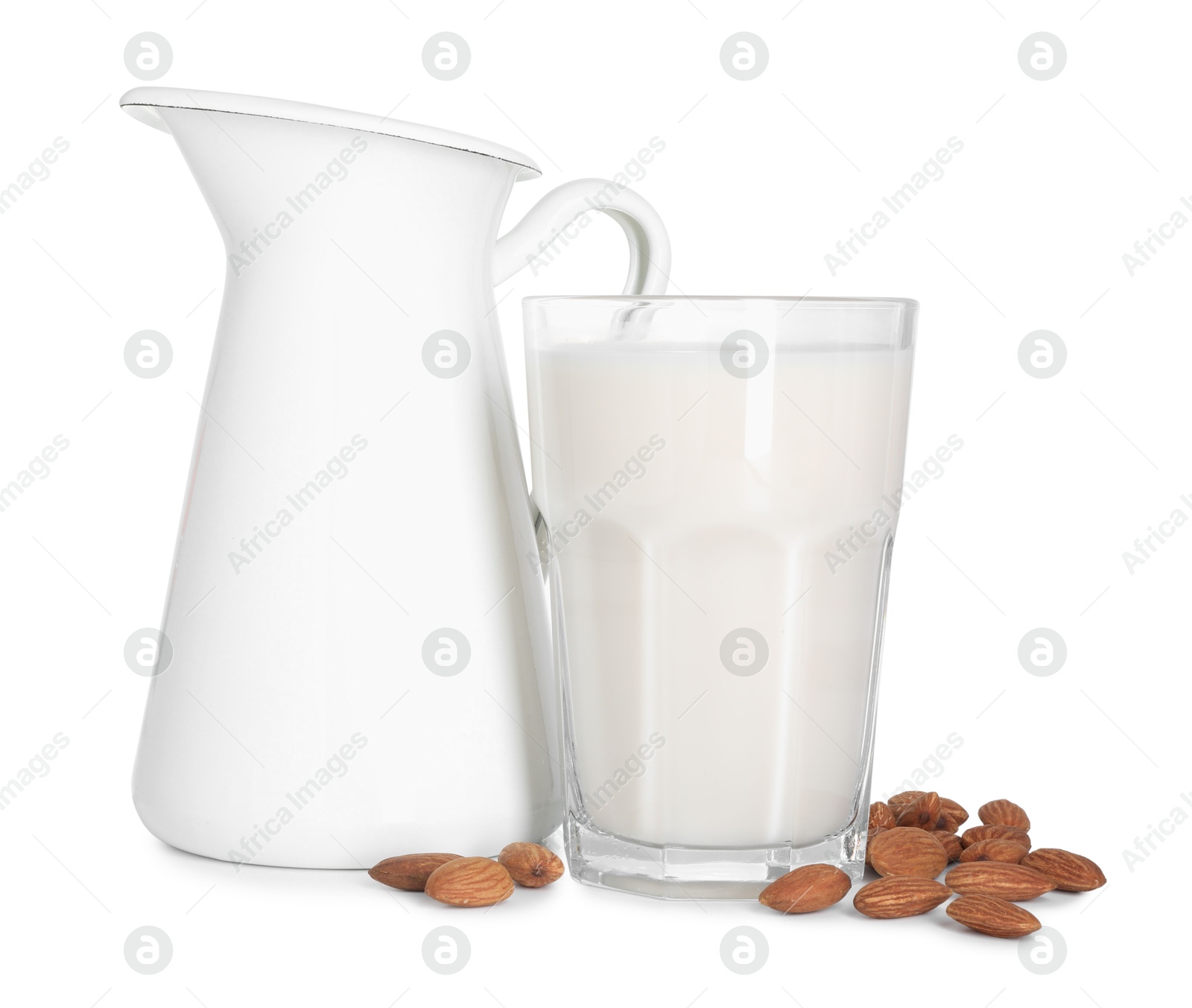 Photo of Glass and jug of almond milk and nuts isolated on white