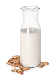 Photo of Bottle of almond milk and nuts isolated on white