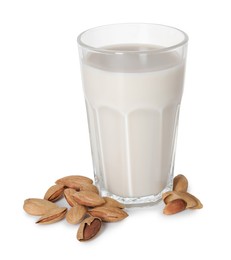 Glass of almond milk and nuts isolated on white