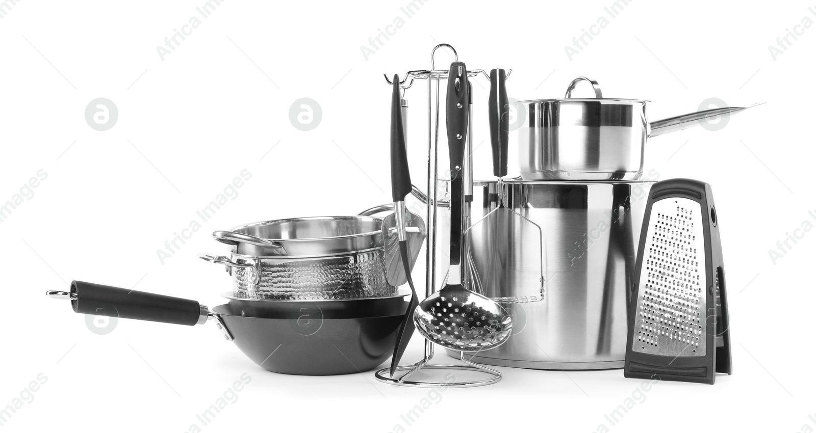 Photo of Dishware and cooking utensils isolated on white