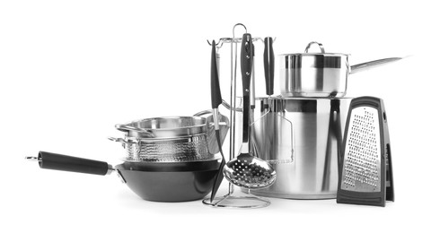 Photo of Dishware and cooking utensils isolated on white