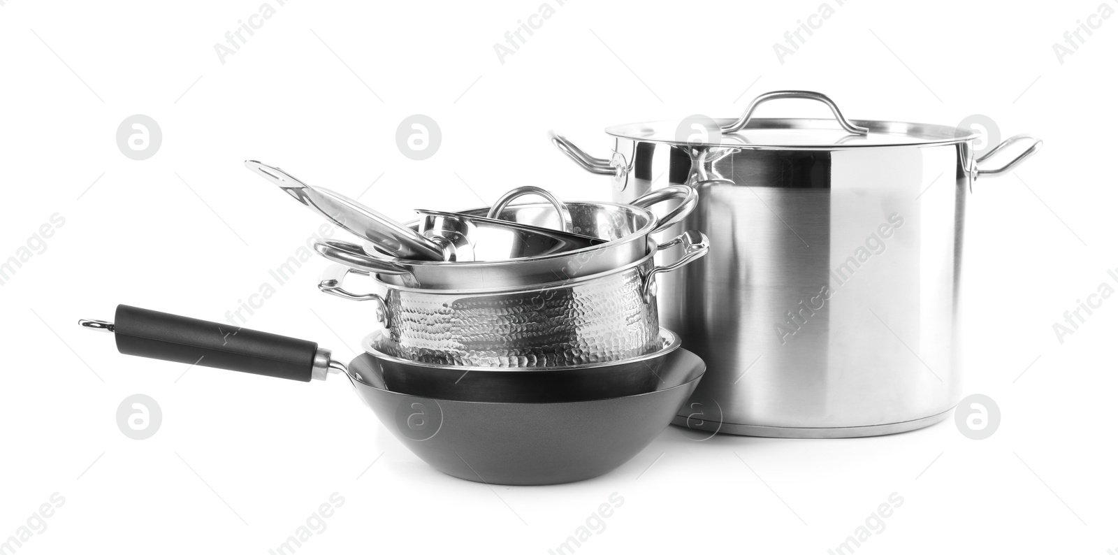 Photo of Dishware and cooking utensils isolated on white