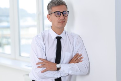 Photo of Portrait of businessman with glasses in office