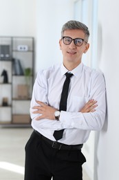 Photo of Portrait of businessman with glasses in office