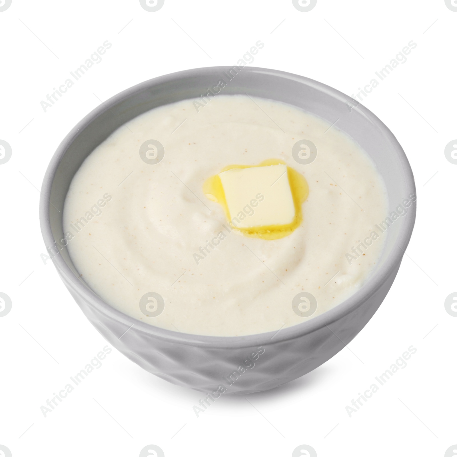 Photo of Tasty cooked semolina porridge with butter isolated on white