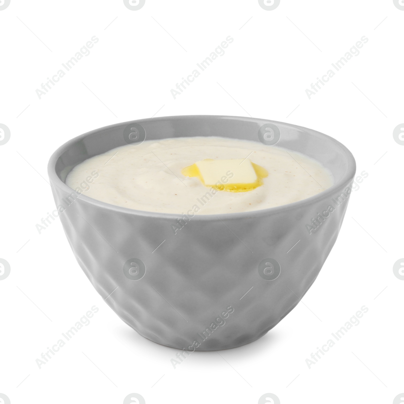 Photo of Tasty cooked semolina porridge with butter isolated on white