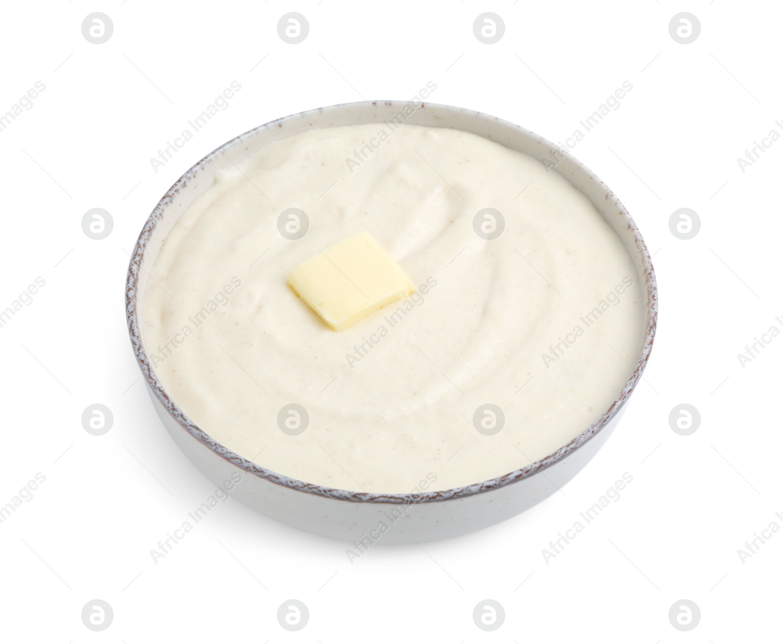 Photo of Tasty cooked semolina porridge with butter isolated on white