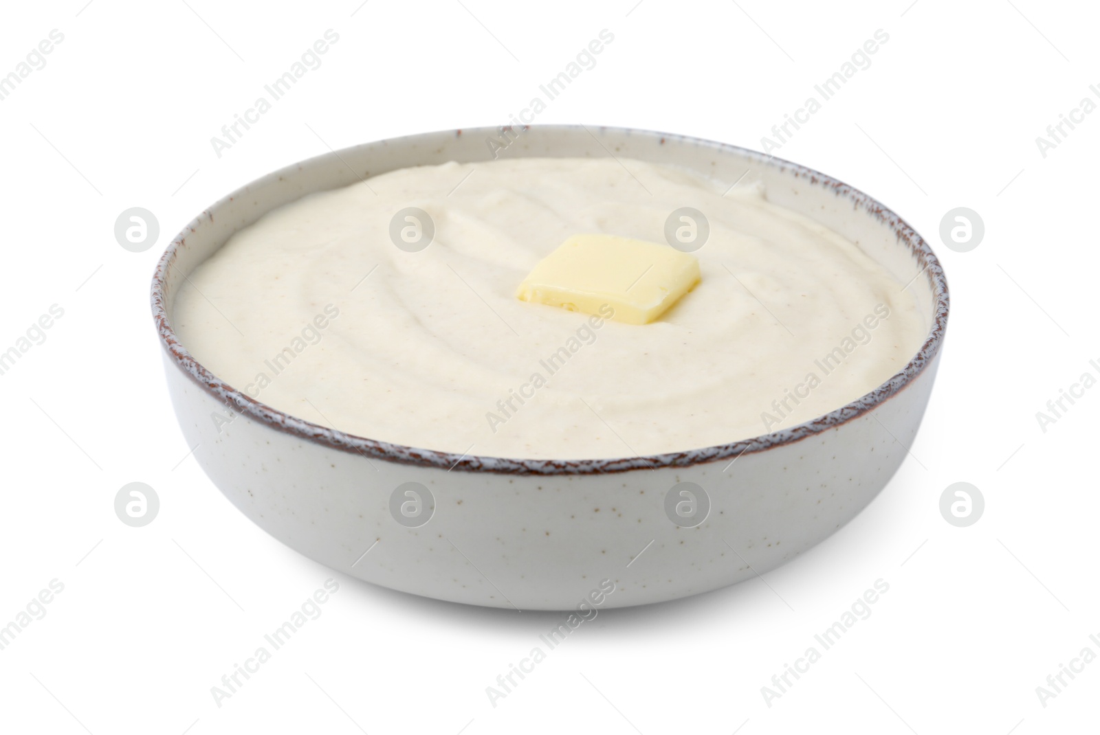 Photo of Tasty cooked semolina porridge with butter isolated on white