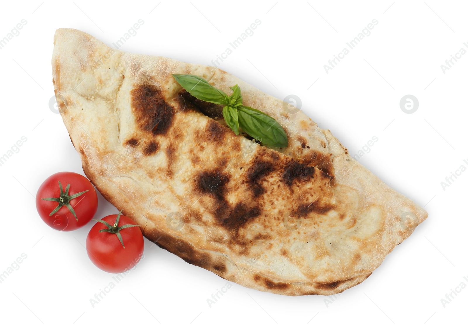 Photo of One delicious calzone with fresh basil and tomatoes isolated on white, top view