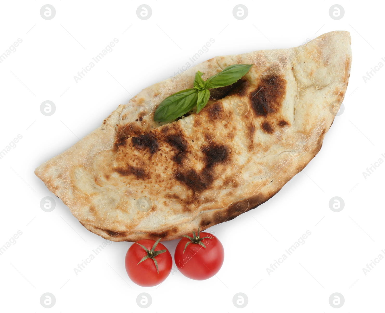 Photo of One delicious calzone with fresh basil and tomatoes isolated on white, top view