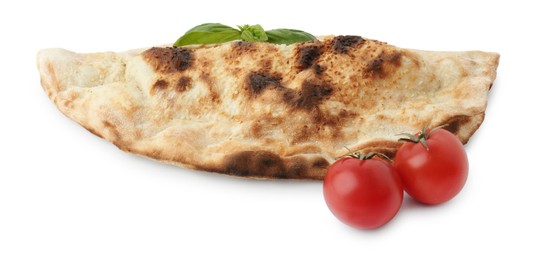 Photo of Delicious calzone with fresh basil and tomatoes isolated on white