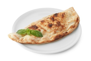 One delicious calzone with fresh basil isolated on white