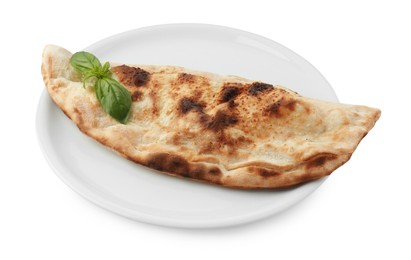 Photo of One delicious calzone with fresh basil isolated on white