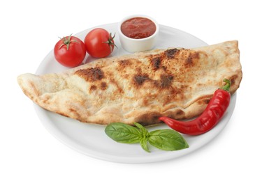 Delicious calzone with ketchup, fresh tomatoes and chili pepper isolated on white