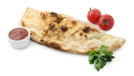 Delicious calzone with fresh parsley, tomatoes and ketchup isolated on white