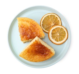 Photo of Tasty semolina cake and orange slices isolated on white, top view