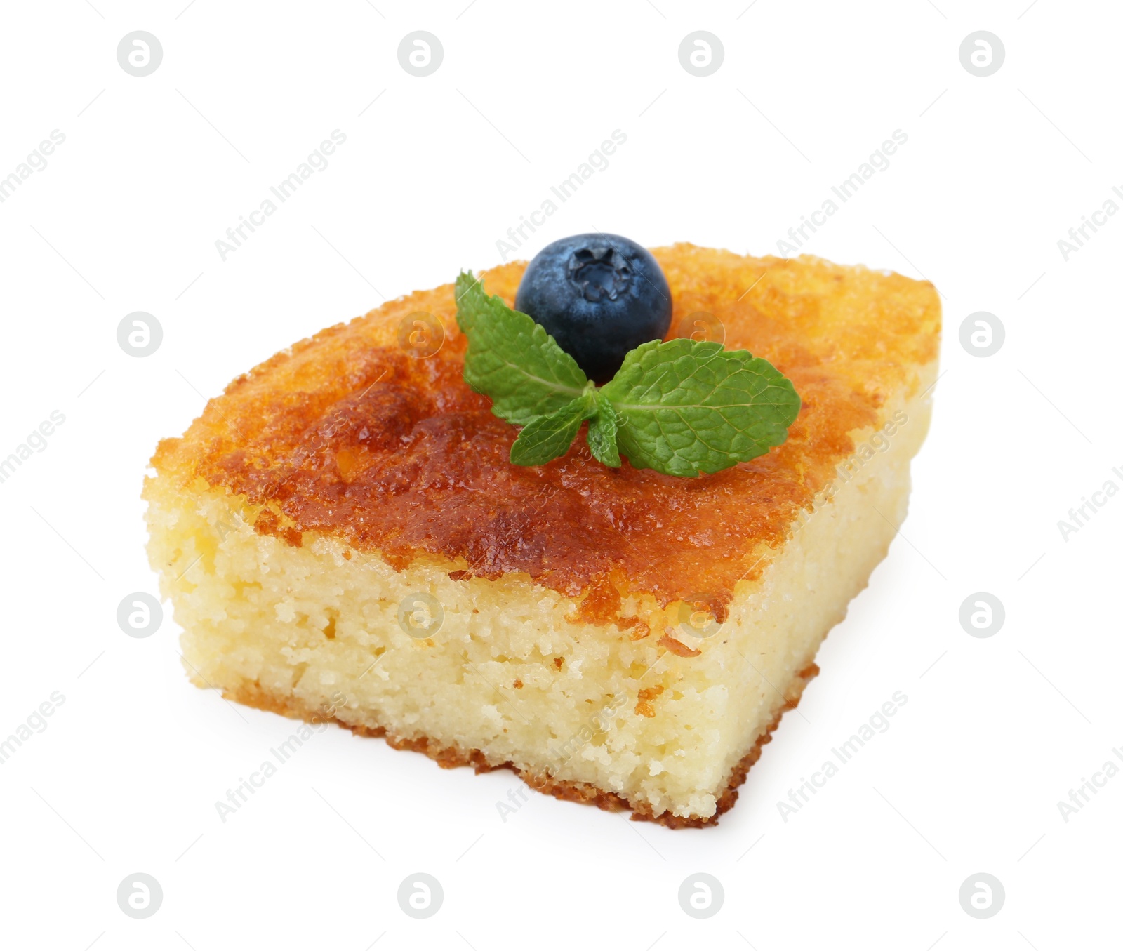 Photo of Slice of tasty homemade semolina cake isolated on white