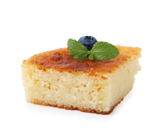 Photo of Slice of tasty homemade semolina cake isolated on white