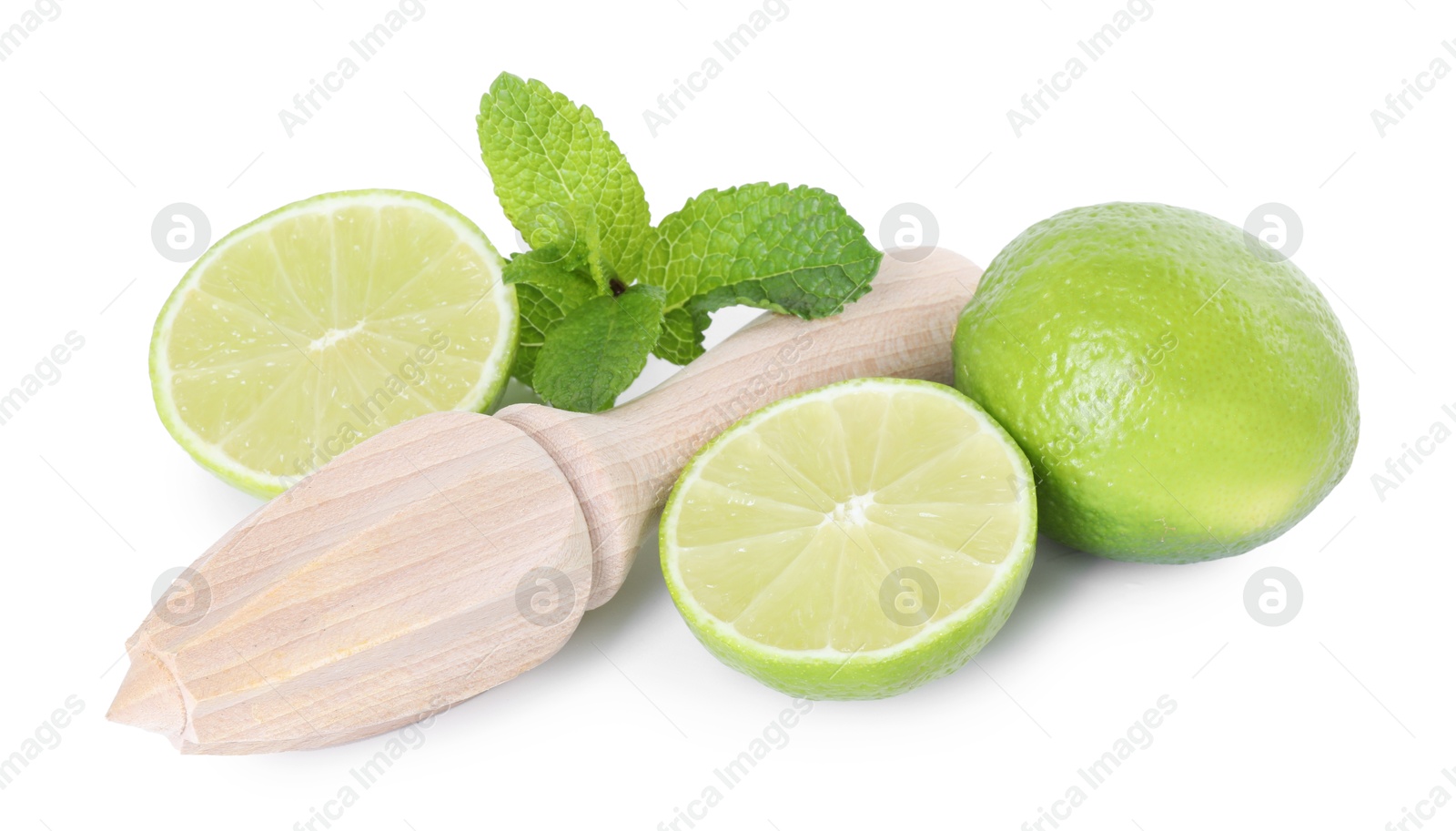 Photo of Wooden juicer, lime and mint isolated on white