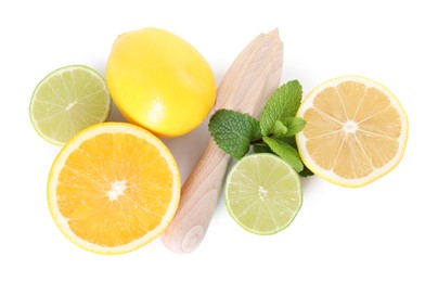 Photo of Wooden juicer, lime, lemon, orange and mint isolated on white, top view